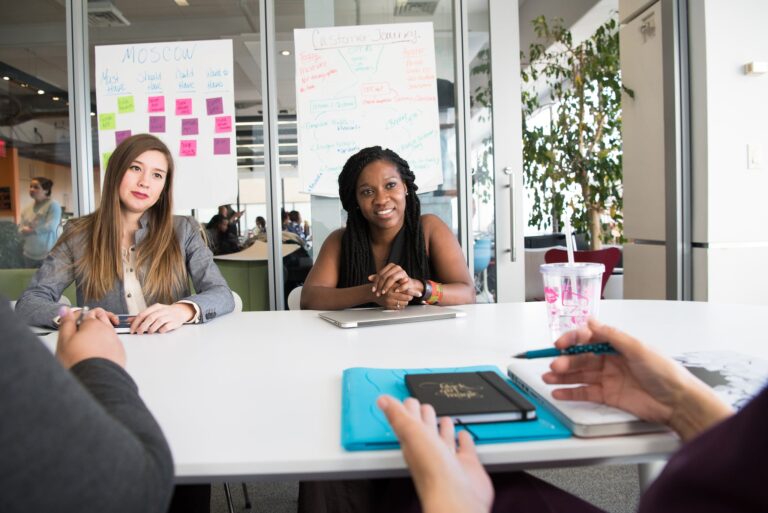 Marketing agency workers discussing best social media strategy