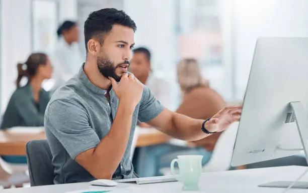 image - a man working on a computer in a SEO agency